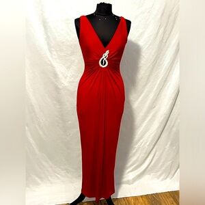 This is a unique, sexy UNIX red snake dress. Exuding passion and strength!